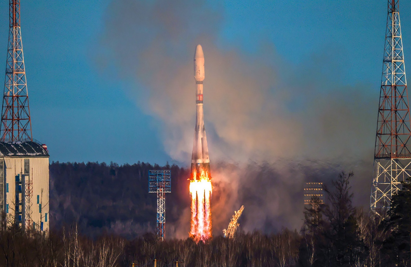 A rocket launching with smoke and flames

Description automatically generated